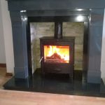 Roaring Fireplaces Installations stove with grey marble surround